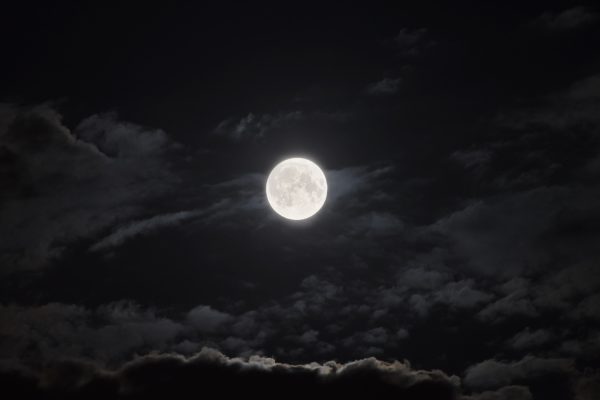 full moon amid clouds